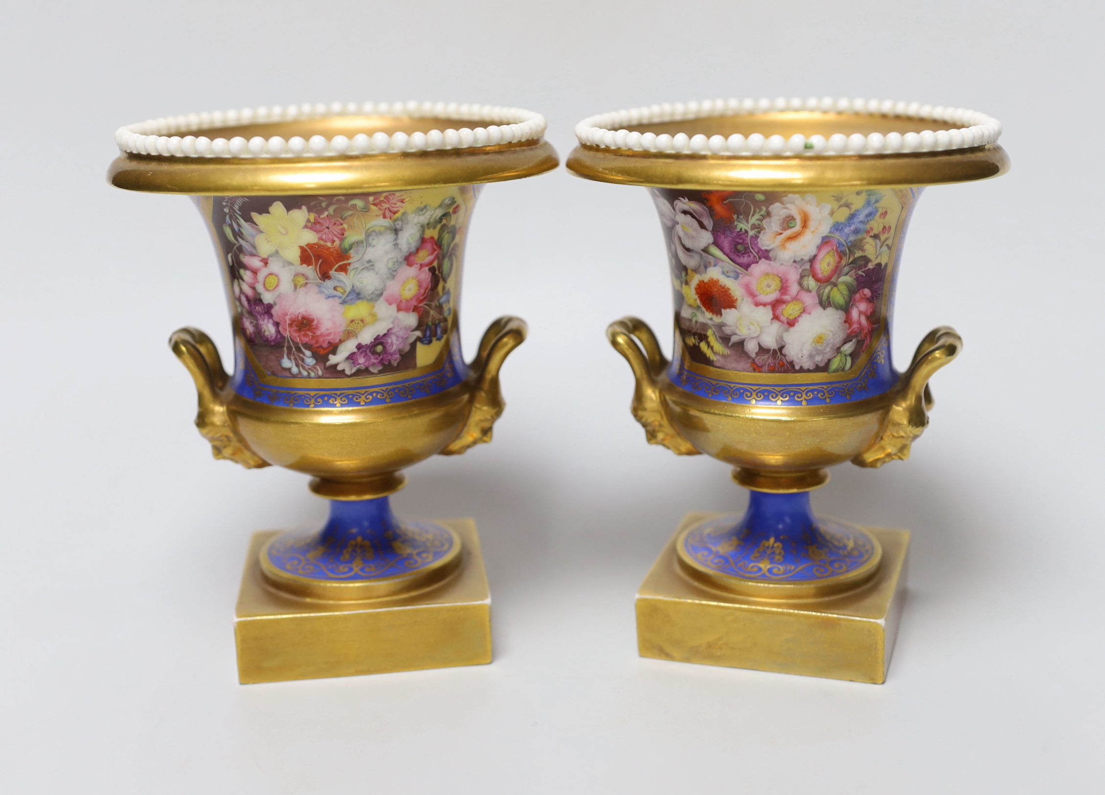 A pair of Minton twin handled urn form vases, hand painted with floral motifs, in the style of Thomas Steele, c.1820